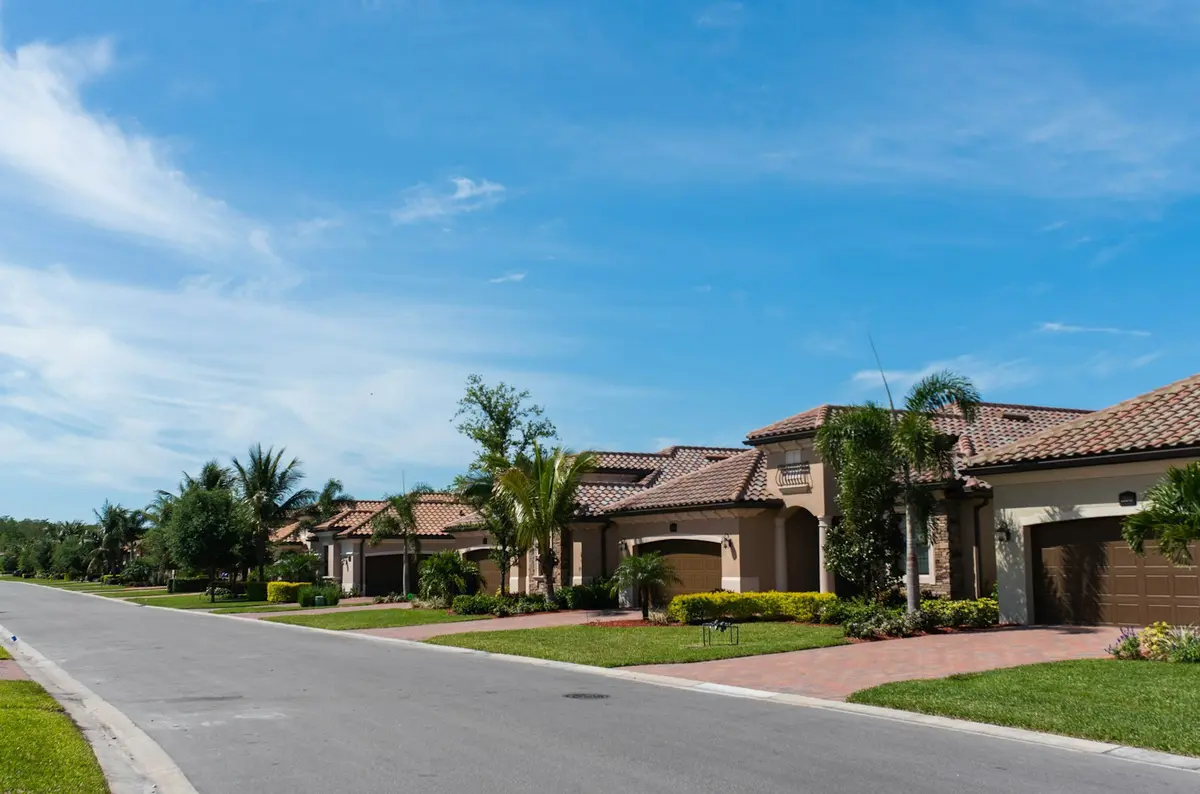 A west Broward street with barrel tile roofs and palm trees, in the water treatment service area